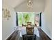 Cozy dining room with modern decor, bright window views, and comfortable seating, perfect for intimate meals and gatherings at 3748 Woodrose Ct, Snellville, GA 30039