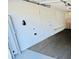 Interior view of a two car garage with carpeted flooring and automatic door at 3748 Woodrose Ct, Snellville, GA 30039