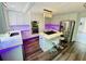 Bright kitchen boasts stainless steel appliances, a kitchen island with a gas stovetop and stylish lighting at 3748 Woodrose Ct, Snellville, GA 30039