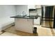 Kitchen with a center island, stainless steel appliances, and ample counter space at 3748 Woodrose Ct, Snellville, GA 30039