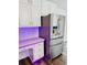 Kitchen has stainless steel refrigerator and workspace with built-in desk and drawers at 3748 Woodrose Ct, Snellville, GA 30039