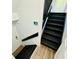 Staircase with newly painted railing and stairs as well as two-tone floor finishes on two levels at 3748 Woodrose Ct, Snellville, GA 30039