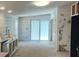 Spacious kitchen with sliding glass doors, white plank walls, stainless steel appliances, and recessed lighting at 7301 Staton Pl, Acworth, GA 30102