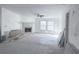 Bright living room with a fireplace, a ceiling fan, and windows overlooking the yard at 7301 Staton Pl, Acworth, GA 30102