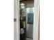 View of a Rheem water heater with a pressure tank and a gray electrical panel box at 7301 Staton Pl, Acworth, GA 30102