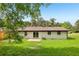Backyard view featuring a small patio and white brick exterior at 2744 Preston Dr, Decatur, GA 30034