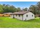 Backyard featuring a well maintained lawn and white brick exterior at 2744 Preston Dr, Decatur, GA 30034