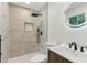 This stylish bathroom offers a rain shower head and modern vanity at 2744 Preston Dr, Decatur, GA 30034