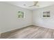 Bedroom featuring wood-look flooring, white walls, and windows at 2744 Preston Dr, Decatur, GA 30034