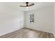 Bedroom with wood-look floors, white walls, and a ceiling fan at 2744 Preston Dr, Decatur, GA 30034