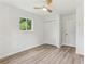 This bright bedroom features wood-look floors, a ceiling fan and double closet at 2744 Preston Dr, Decatur, GA 30034