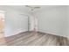 A well lit bedroom with light gray wood flooring and double door closet at 2744 Preston Dr, Decatur, GA 30034