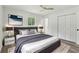 This bedroom features a modern ceiling fan, a plush rug and stylish matching end tables at 2744 Preston Dr, Decatur, GA 30034