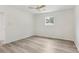 A clean and spacious bedroom with light grey laminate flooring and natural light at 2744 Preston Dr, Decatur, GA 30034