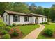 Inviting single-story house with a manicured lawn, brick pathway, and fresh landscaping at 2744 Preston Dr, Decatur, GA 30034