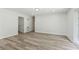 Bright living room with modern flooring, white walls, and access to backyard with sliding doors at 2744 Preston Dr, Decatur, GA 30034