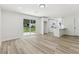 Open-concept living room next to bright modern kitchen with sliding glass doors leading to backyard at 2744 Preston Dr, Decatur, GA 30034