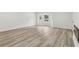 Bright, empty living room with hardwood floors, fresh paint, and natural light at 2744 Preston Dr, Decatur, GA 30034