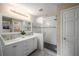 Modern bathroom with double vanity, glass-door shower, and contemporary fixtures at 299 Stockwood Dr, Woodstock, GA 30188