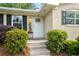 Charming brick home featuring a well-manicured front yard and inviting front door at 299 Stockwood Dr, Woodstock, GA 30188
