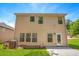 Spacious backyard featuring a well-maintained lawn and a two-story home at 3567 Sycamore Bnd, Decatur, GA 30034