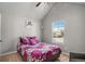 Bright bedroom with vaulted ceilings, a large window, and a single chair at 3567 Sycamore Bnd, Decatur, GA 30034