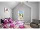 Bright bedroom with vaulted ceilings, a large window, and modern decor at 3567 Sycamore Bnd, Decatur, GA 30034
