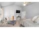 Well-lit bedroom with vaulted ceilings and modern decor, featuring a lounge chair at 3567 Sycamore Bnd, Decatur, GA 30034