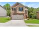 Charming two-story home featuring a brick facade, two-car garage, and beautiful, well-maintained landscaping at 3567 Sycamore Bnd, Decatur, GA 30034