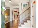 Welcoming foyer featuring hardwood floors, staircase with iron spindles, and a view into the living spaces at 3567 Sycamore Bnd, Decatur, GA 30034