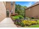 A well-landscaped front yard features a colorful array of flowers leading to the front door of the house at 3567 Sycamore Bnd, Decatur, GA 30034
