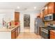 Traditional kitchen with stainless steel appliances, granite countertops, and wood cabinets at 3567 Sycamore Bnd, Decatur, GA 30034