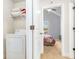 Classic laundry room with open shelving and washer and dryer at 3567 Sycamore Bnd, Decatur, GA 30034