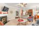 Open-concept living room and kitchen area with fireplace, neutral decor, and modern finishes at 3567 Sycamore Bnd, Decatur, GA 30034