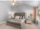 Bright main bedroom featuring a plush bed, vaulted ceiling, and mirrored nightstands at 3567 Sycamore Bnd, Decatur, GA 30034