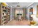 Stylish home office featuring neutral walls, built-in bookshelves, and a work area with natural light at 3567 Sycamore Bnd, Decatur, GA 30034