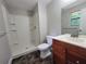 Bathroom featuring a shower, toilet, and vanity with ample counter space at 4063 Feather Dr, Douglasville, GA 30135
