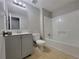 Well-lit bathroom with a bathtub, toilet, and vanity at 4063 Feather Dr, Douglasville, GA 30135