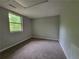 Bedroom with neutral walls and carpet and natural light at 4063 Feather Dr, Douglasville, GA 30135