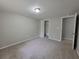Bedroom with carpet, a closet and an adjacent doorway at 4063 Feather Dr, Douglasville, GA 30135