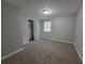 Bedroom with carpet, a closet and a window at 4063 Feather Dr, Douglasville, GA 30135