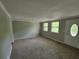 Spacious carpeted living room featuring neutral walls, front door and natural light at 4063 Feather Dr, Douglasville, GA 30135
