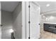 View into a finished basement area with a gray accent kitchen and recessed lighting at 4145 White Oak Dr, Winston, GA 30187