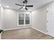 Bright bedroom features wood-look floors, a ceiling fan, neutral paint and a window with a view at 4145 White Oak Dr, Winston, GA 30187
