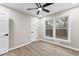 This spacious bedroom offers lots of natural light from its oversized window and features a ceiling fan at 4145 White Oak Dr, Winston, GA 30187