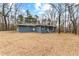 Charming single-story home featuring a blue brick exterior and a well-manicured lawn at 4145 White Oak Dr, Winston, GA 30187