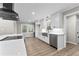 Bright kitchen boasts white cabinets, quartz countertops, and stainless steel appliances at 4145 White Oak Dr, Winston, GA 30187