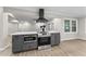 Kitchen island featuring white countertop, dark cabinetry, microwave and oven at 4145 White Oak Dr, Winston, GA 30187