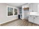 Bright kitchen with custom cabinets, shelves, and a beverage refrigerator at 4145 White Oak Dr, Winston, GA 30187
