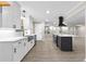 Well-lit kitchen featuring white countertops, stainless steel appliances, and dark island at 4145 White Oak Dr, Winston, GA 30187